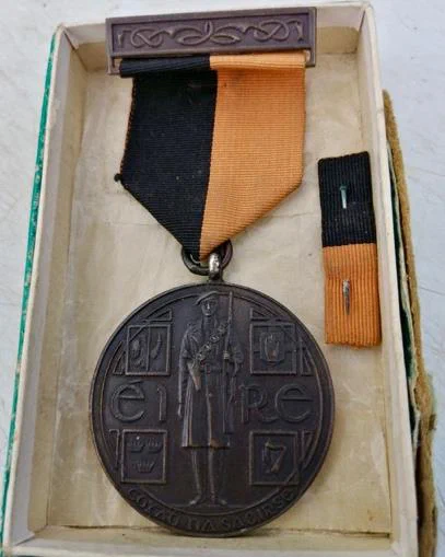 Michael Barrett&rsquo;s Black and Tan medal, awarded in 1953.